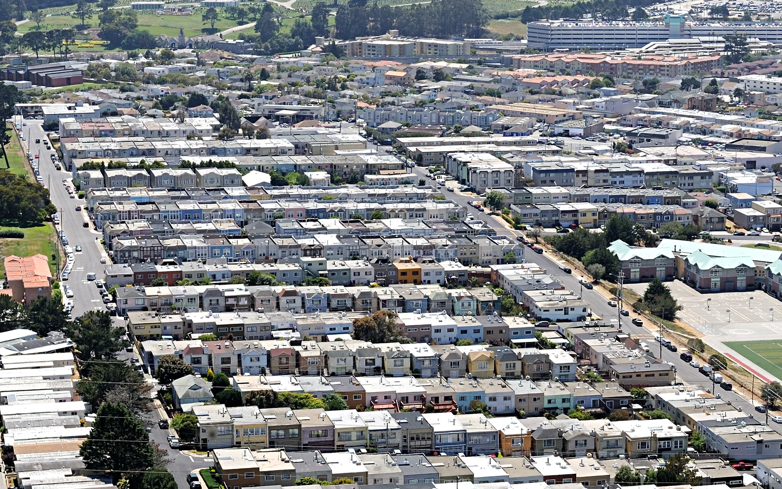 Hillside residential neighborhoods in Daly City viewed from San Bruno Mountain State Park, showing the diverse housing and community landscape